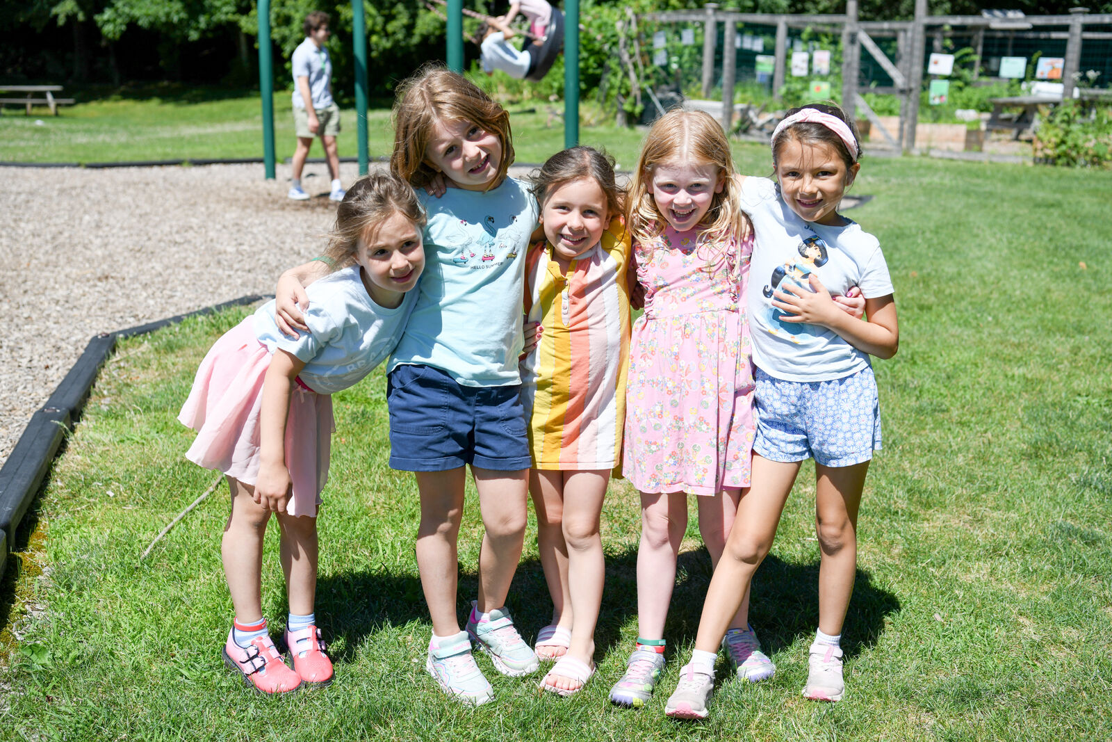 Children enjoying a sunny day on the Branches campus